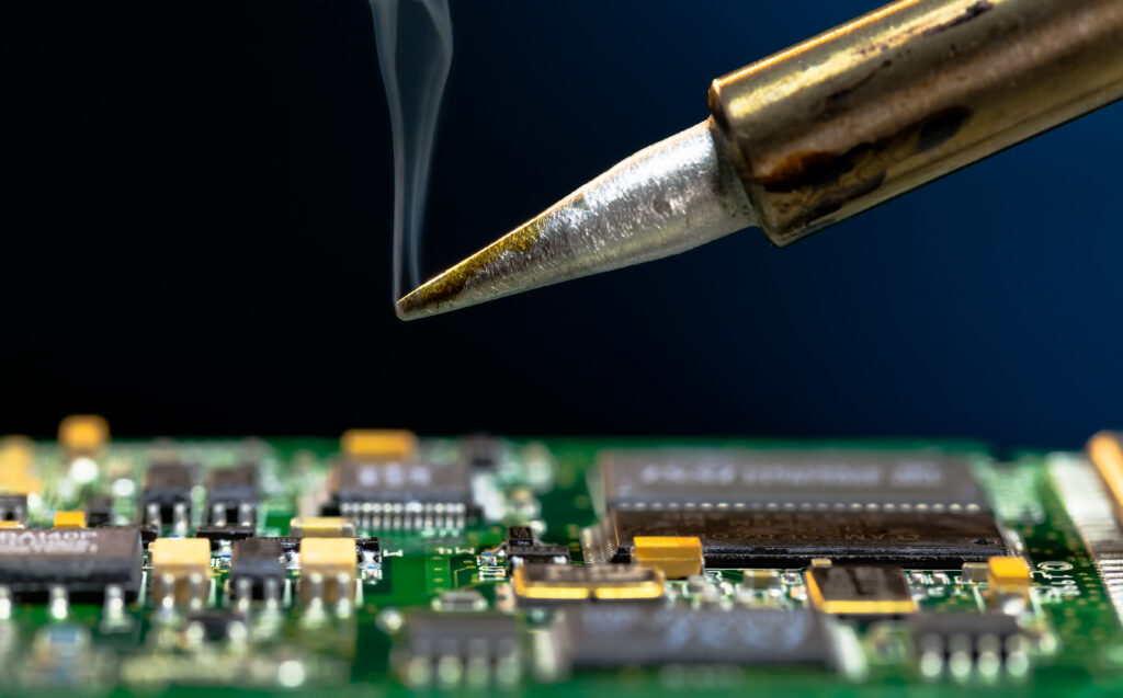 Image of soldering iron conducting PCB assembly 