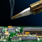 Image of soldering iron conducting PCB assembly